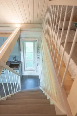 a staircase in a tiny house with a window at VieniKrante in Utena