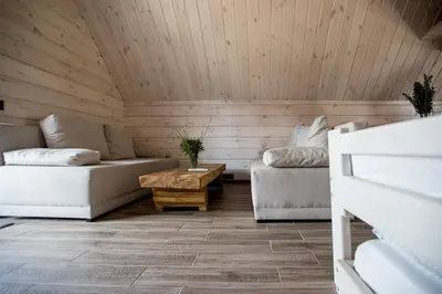 a room with a couch and a coffee table at Family house Vila Rica in Ricieliai