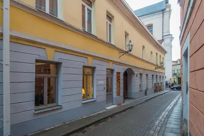an empty street in a city with buildings at COME2rest - Stikliu 20 in Vilnius