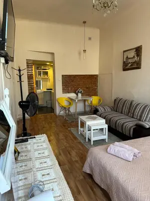 a living room with a couch and a table at Sija's house in Kaunas