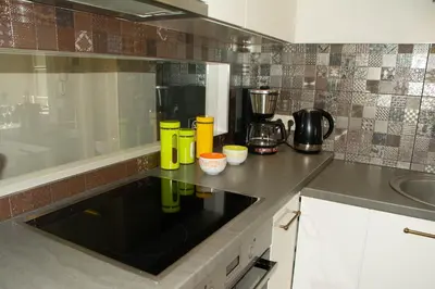 a kitchen with a sink and a counter top at A perfect base to explore Vilnius! in Vilnius