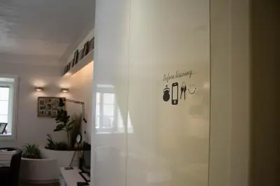a room with a glass door with a sign on it at A perfect base to explore Vilnius! in Vilnius