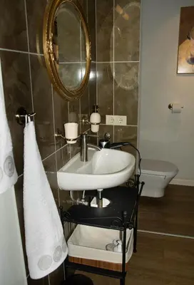 a bathroom with a sink and a mirror at A perfect base to explore Vilnius! in Vilnius