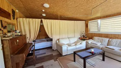 a living room with a couch and a table at Scent yard in Marijampolė