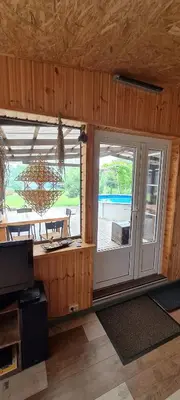 a room with a large window with a view of the ocean at Scent yard in Marijampolė