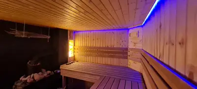 a sauna with purple lights in a room at Scent yard in Marijampolė