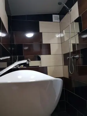 a bathroom with a white sink and a shower at Scent yard in Marijampolė