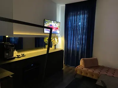 a room with a desk and a chair and a mirror at Modern and Luxury Apartment in the Center of Kaunas in Kaunas