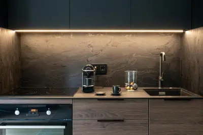 a kitchen with a counter top with aounter at Modern boutique apartment in the city center in Druskininkai