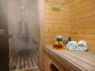 a sauna with a counter with fruit on it at Kliukai in Dubingiai
