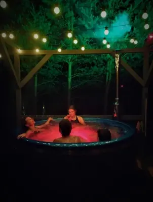 a group of people in a jacuzzi in aysicalysicalysicalysical at Kliukai in Dubingiai