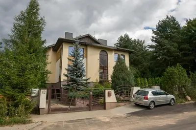 a house with a car parked in front of it at Laura in Vilnius