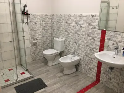 a bathroom with a toilet and a sink at Laura in Vilnius