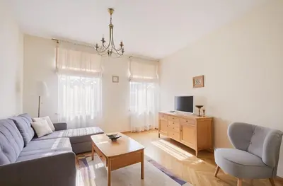 a living room with a couch and a tv at Old Town apartment in Kaunas