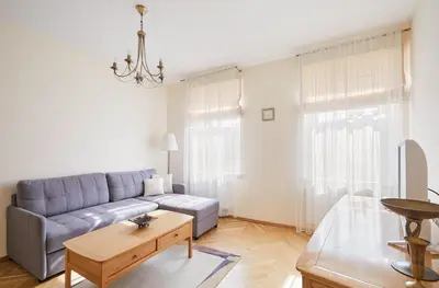 a living room with a couch and a table at Old Town apartment in Kaunas