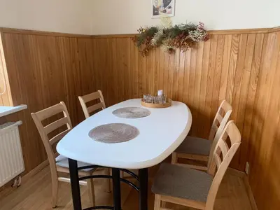 a white table and chairs in a room at Old Town apartment in Kaunas
