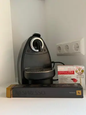 a iron sitting on top of a box at Alytus Apartament in Alytus