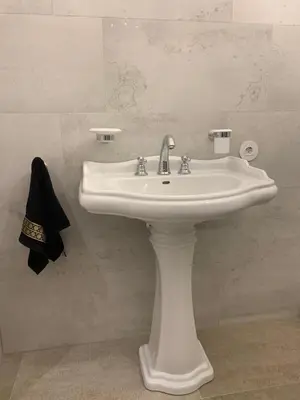 a bathroom with a white sink in a room at Kranto apartaments in Panevėžys