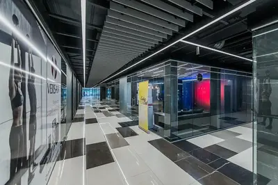 a hallway of a building with a checkered floor at Zaliakalnio terasos apartamentai in Kaunas