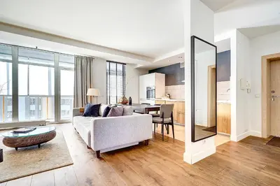 a living room with a couch and a table at Vilnius Apartments & Suites in Vilnius