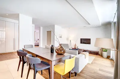 a dining room with a table and chairs at Vilnius Apartments & Suites in Vilnius