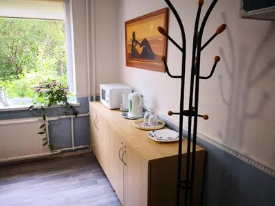 a kitchen with a counter with a microwave on it at KAMBARIŲ nuoma Kaune - in Kaunas