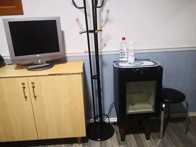 a room with a television and a computer on a desk at KAMBARIŲ nuoma Kaune - in Kaunas