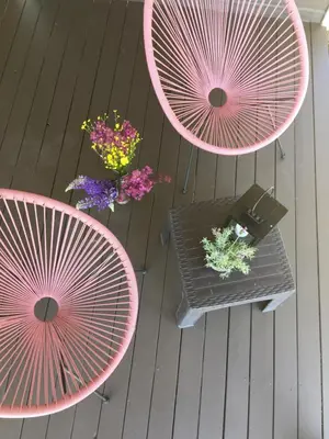 an overhead view of two pink tables and flowers at Economy rooms for 2-4 people in Anykščiai