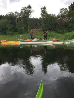 a group of people in boats on the water at Economy rooms for 2-4 people in Anykščiai