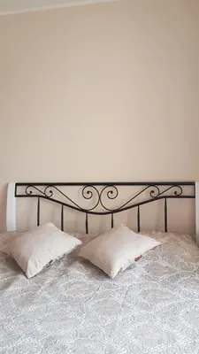 a black and white bed with two pillows on it at Vacation in druskininkai in Druskininkai