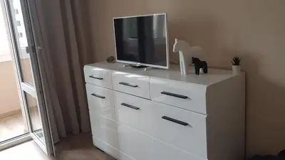 a white dresser with a television on top of it at Vacation in druskininkai in Druskininkai