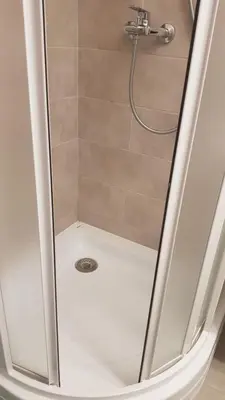 a shower with a shower head in a bathroom at Vacation in druskininkai in Druskininkai