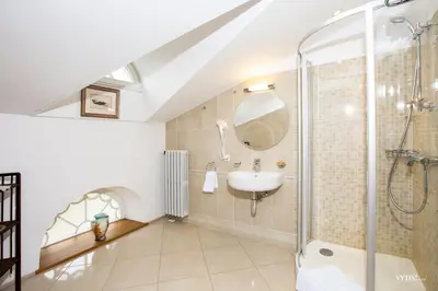 a bathroom with a shower and a sink at Burbiskio dvaras in Anykščiai