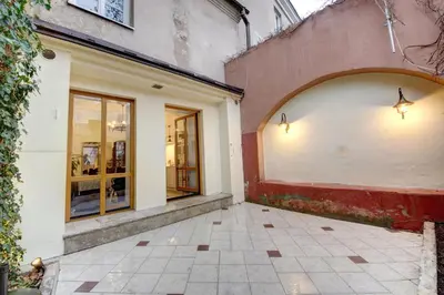 an entrance to a building with an arch on it at Vilnius Old town apartments in Vilnius