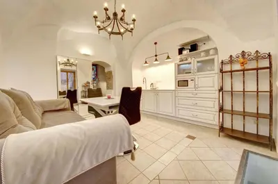 a living room with a couch and a table at Vilnius Old town apartments in Vilnius
