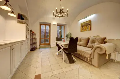 a living room with a couch and a table at Vilnius Old town apartments in Vilnius