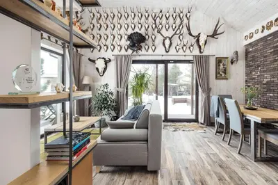a living room with a couch and a table at Riese Apartments in Riese