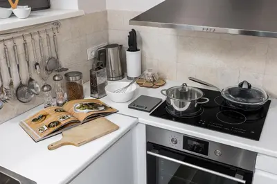a kitchen with a stove and a counter top at Riese Apartments in Riese