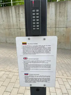 a sign is attached to a parking meter at Valensia Apartment in Druskininkai