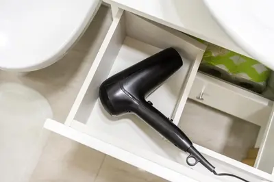 a black bottle in a drawer in a cabinet at #stayhere - Light Vilnius views Loft City Center in Vilnius