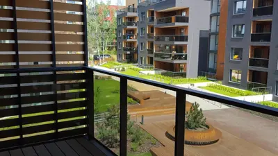 an apartment balcony with a view of a courtyard at Antakalnis Apartment in Vilnius