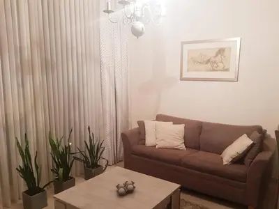 a living room with a couch and a coffee table at Antakalnis Apartment in Vilnius
