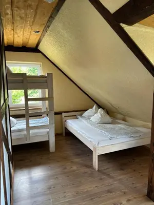 a bedroom with two bunk beds in a attic at Homestead 
