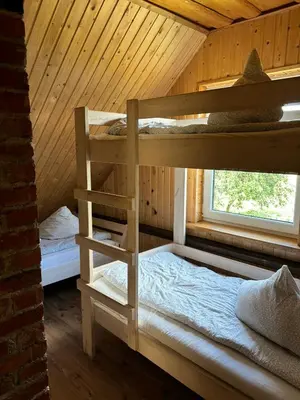a bedroom with two bunk beds in a cabin at Homestead 