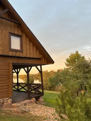 a wooden building with a window on the side of it at Homestead 