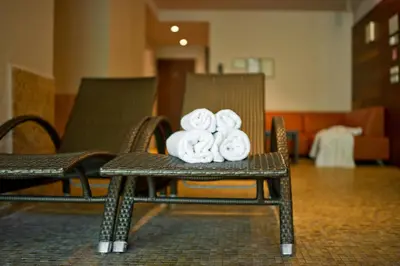 a pile of donuts sitting on a chair at Belvilis Hotel in Molėtai
