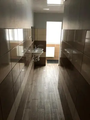 a bathroom with a sink and a toilet at Hostel Laurita in Kaunas