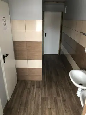 a bathroom with a toilet and a sink at Hostel Laurita in Kaunas