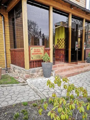 a store front of a building with a sign in the window at Vila Marta in Druskininkai