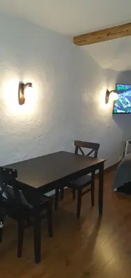 a ping pong table in a room with two lights at senamiescio deimantas in Vilnius